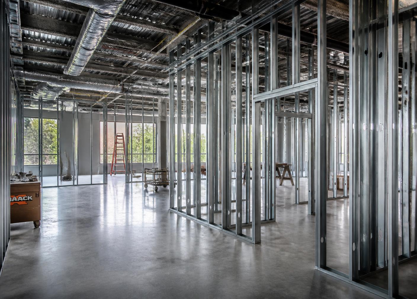 Commercial interior build-out with metal stud framing under construction